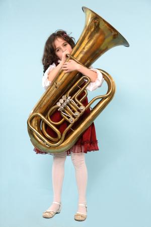 young girl playing a tuba